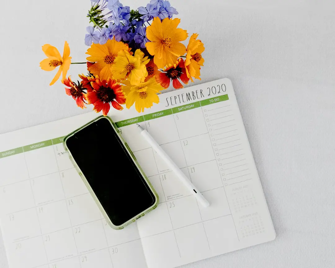 September 2020 planner and techy tools tools by Case Brands black iphone 5 on white paper