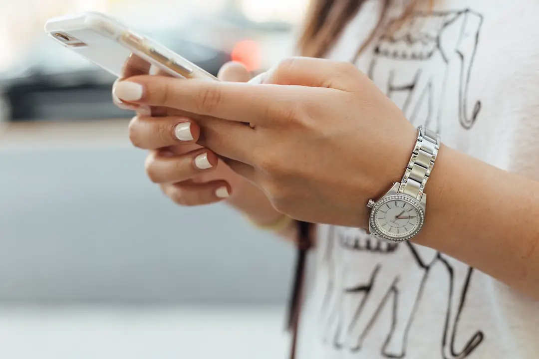 Conclusion by Case Brands woman holding iPhone during daytime