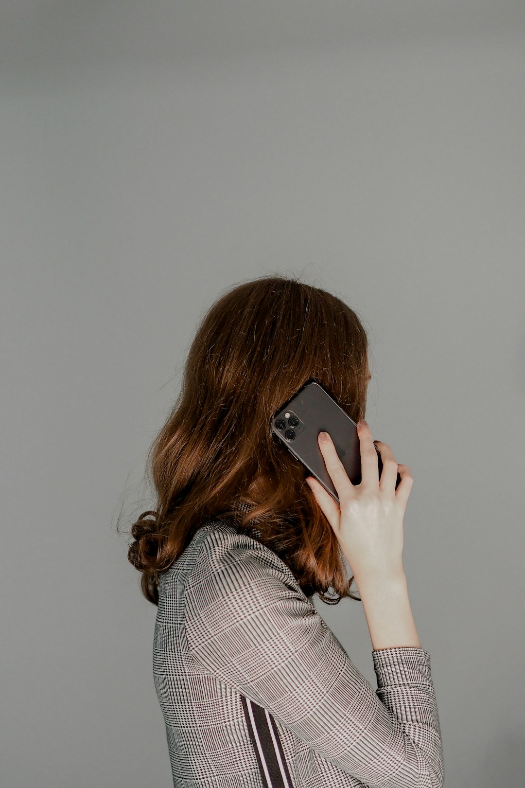 a woman holding a phone
