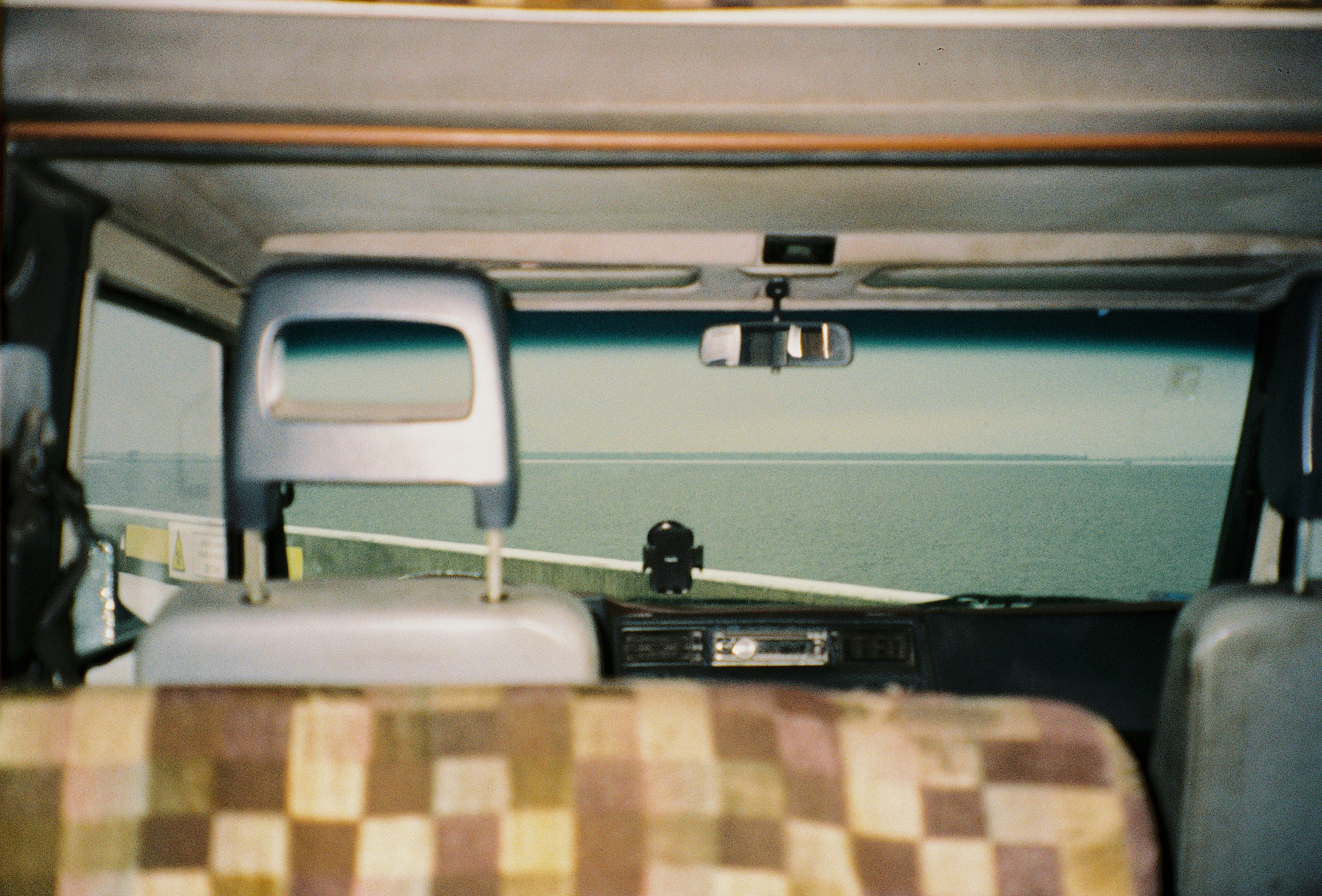 a view of the back of a vehicle from inside the vehicle