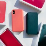 pink iPhone X among boxes